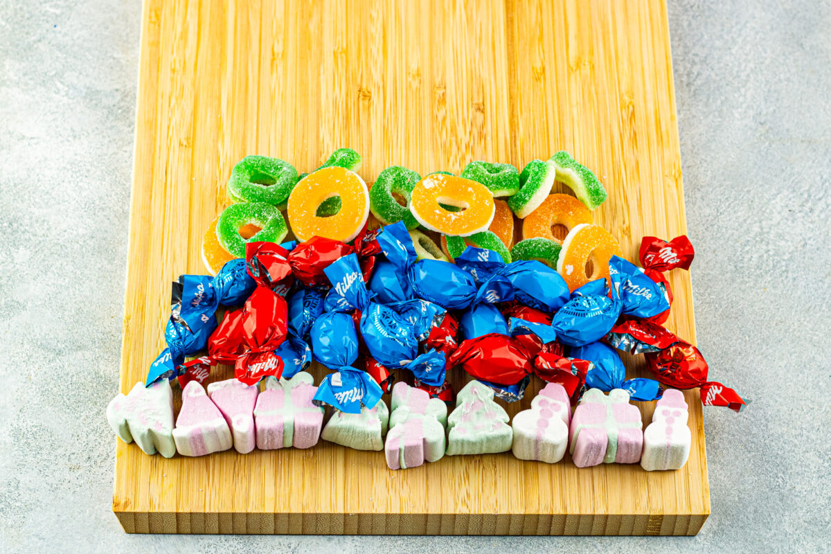 Layering the different candies to create this candy tree charcuterie board