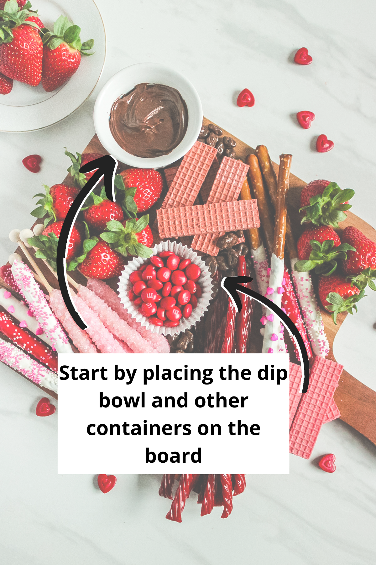 start making your dessert charcuterie board by placing small bowls and containers on the board