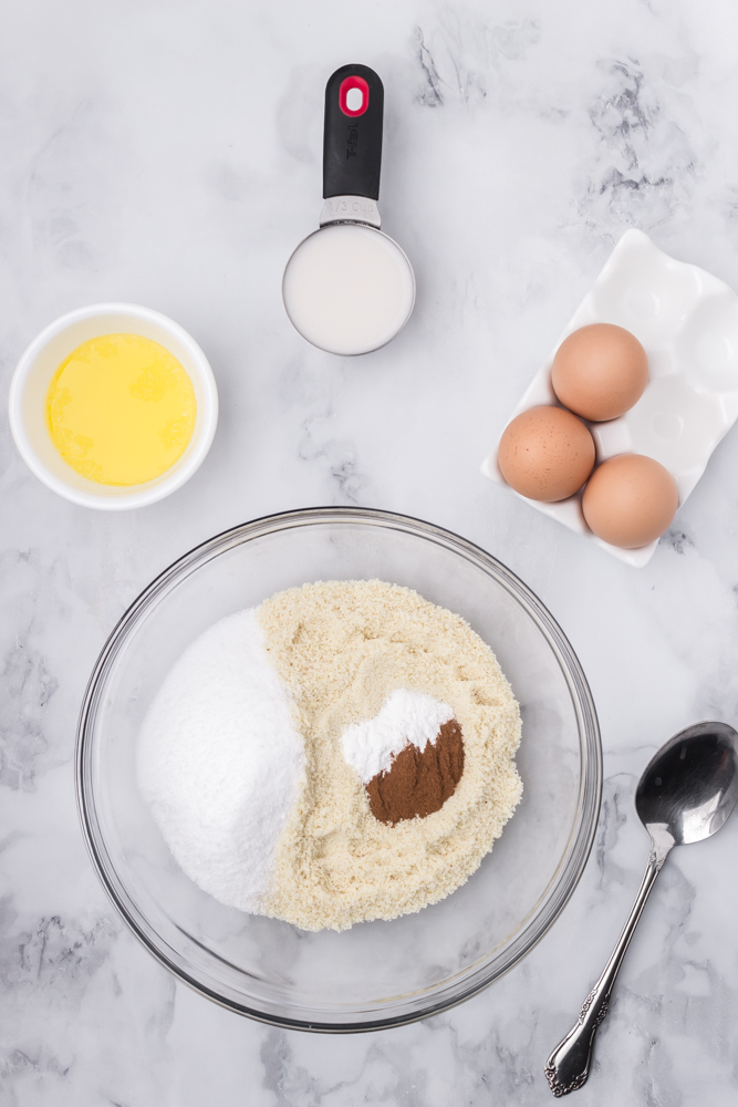 combining the almond flour, sweetener, cinnamon and baking powder in a mixing bowl.