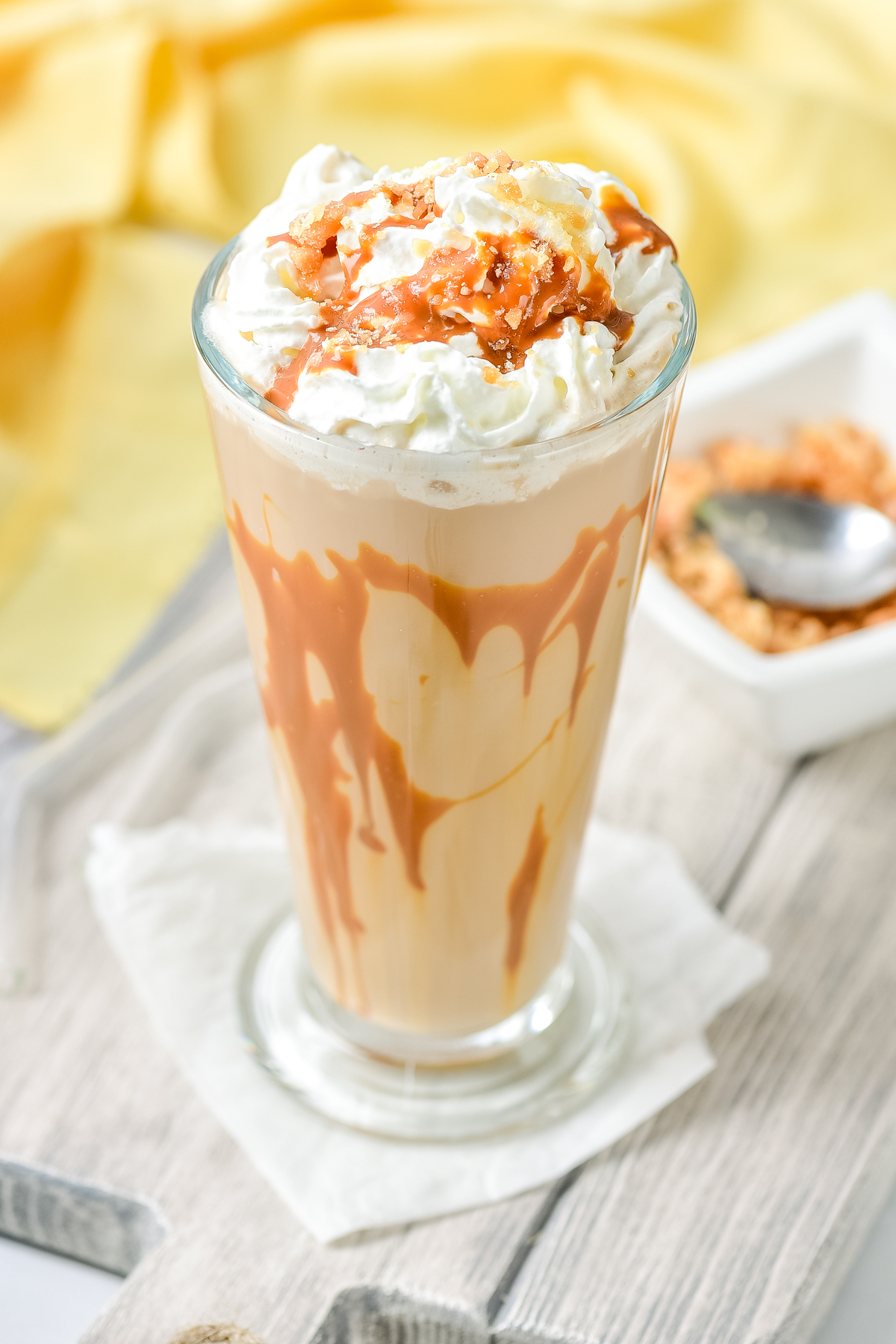 caramel drizzle and toffee bits on top of this copycat icy caramel coffee frappe 