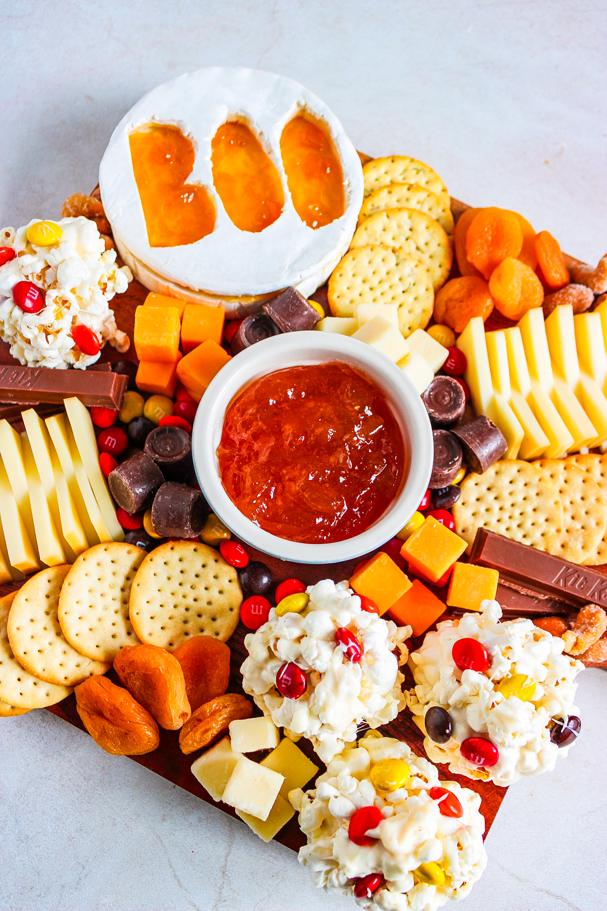 spooky halloween snack board filled with savory and sweet treats