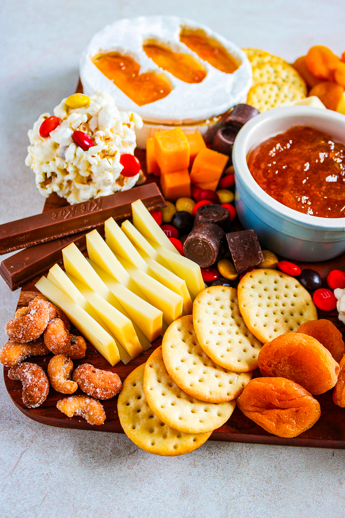 halloween board filled with salty snacks and sweet treats for your next halloween party