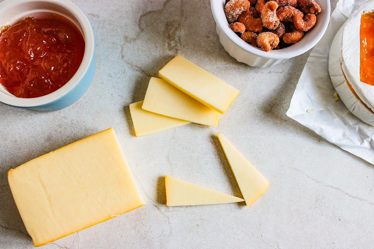 cutting the slices of cheese into triangles