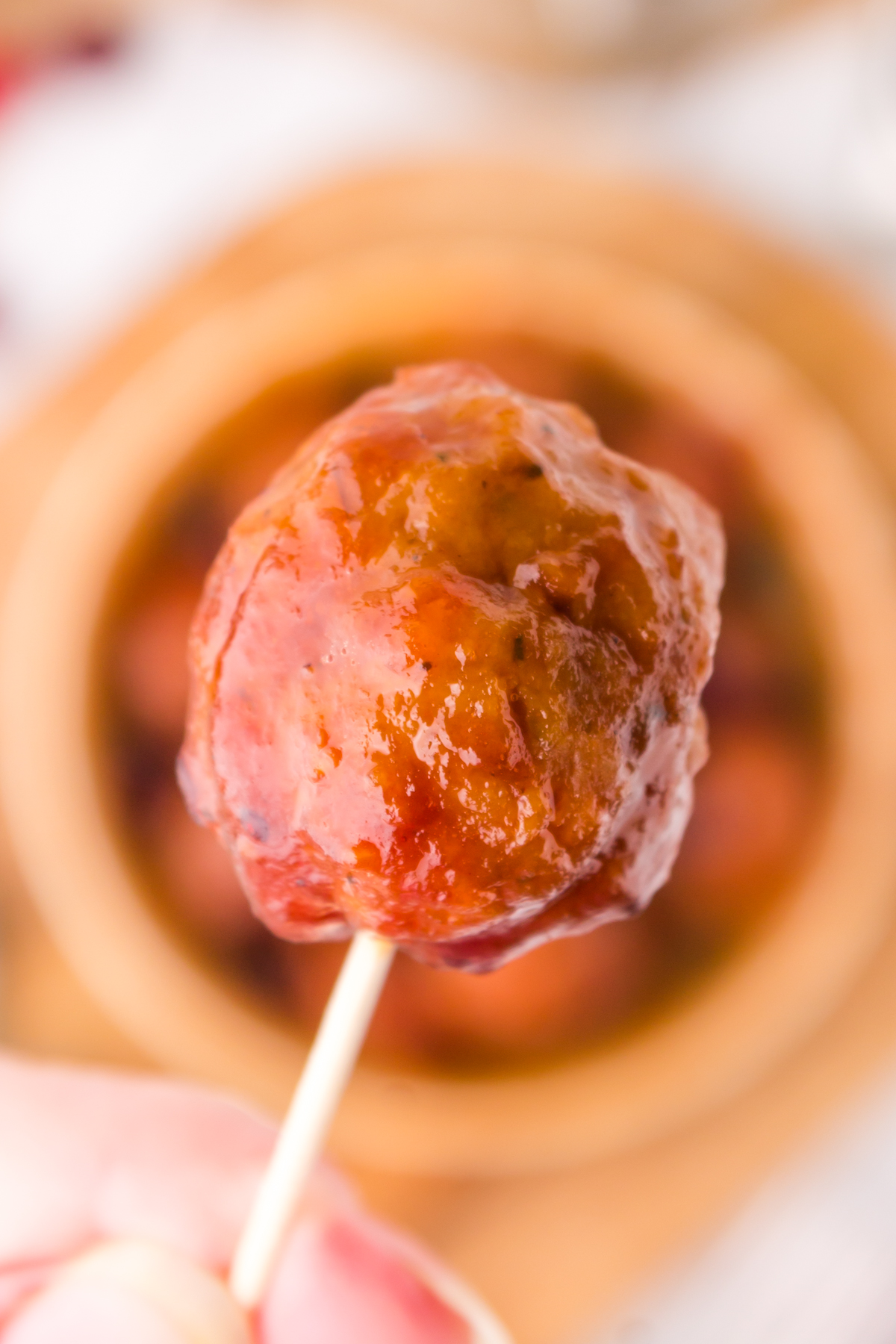 Cranberry BBQ meatballs on a toothpick as a perfect party appetizer