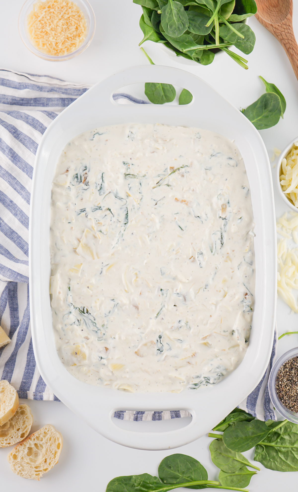 mixed spinach artichoke dip in a baking dish