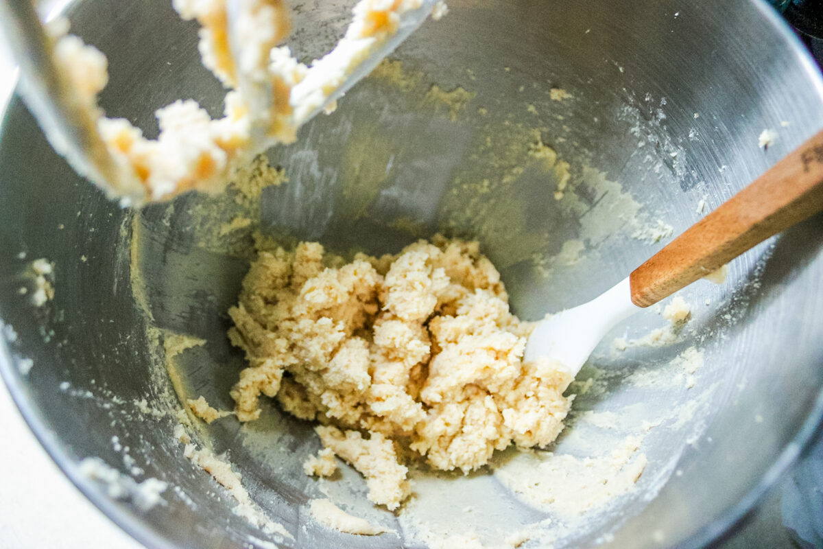 mixing the flour into the chilled butter to make shortbread cookies