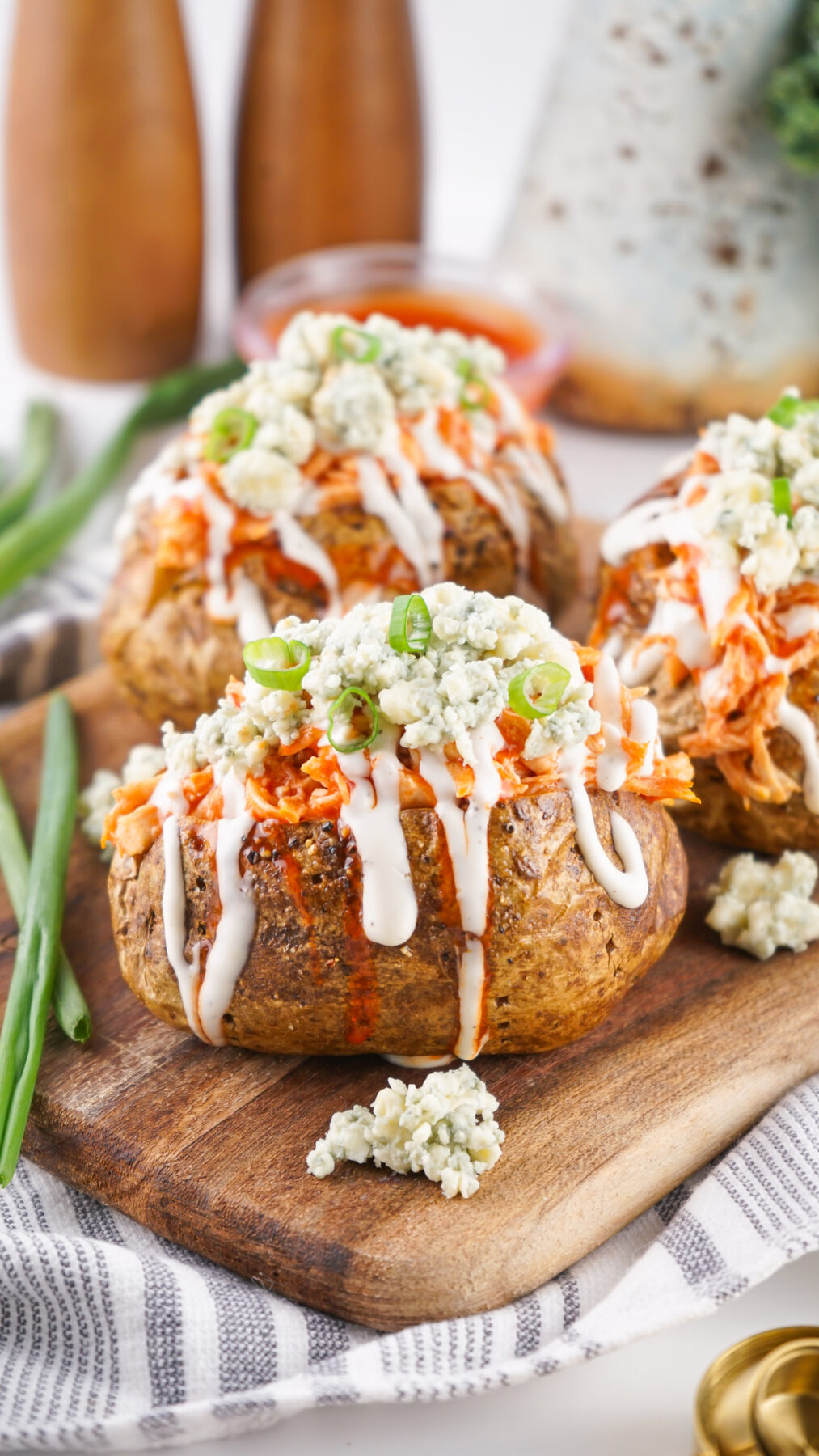 buffalo chicken potatoes on a cutting board