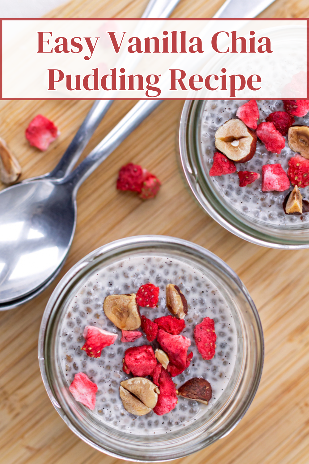 bowls of vanilla chia pudding topped with chopped nuts and strawberries on a table