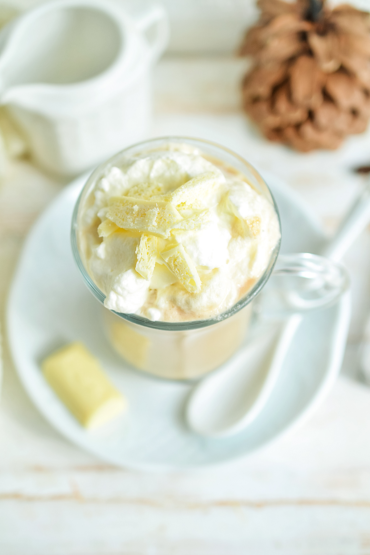 Starbucks White Chocolate Mocha topped with whipped cream and white chocolate shavings