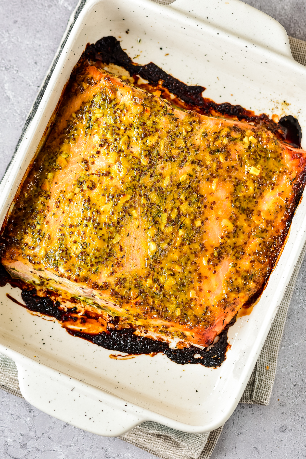 Finished Baked Honey Mustard Salmon in baking dish.